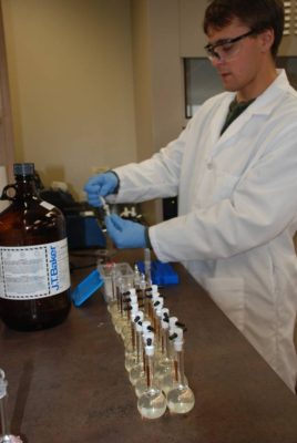 Filtration of test solutions in Aurora Pharmaceutical Quality Control Lab