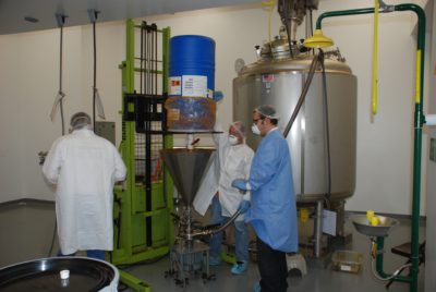 Aurora staff charge in PVPI into large formulation tank using a circulatory pump.